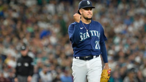 Mariners starting pitcher Luis Castillo pumps his fist after getting an out vs. Cleveland.